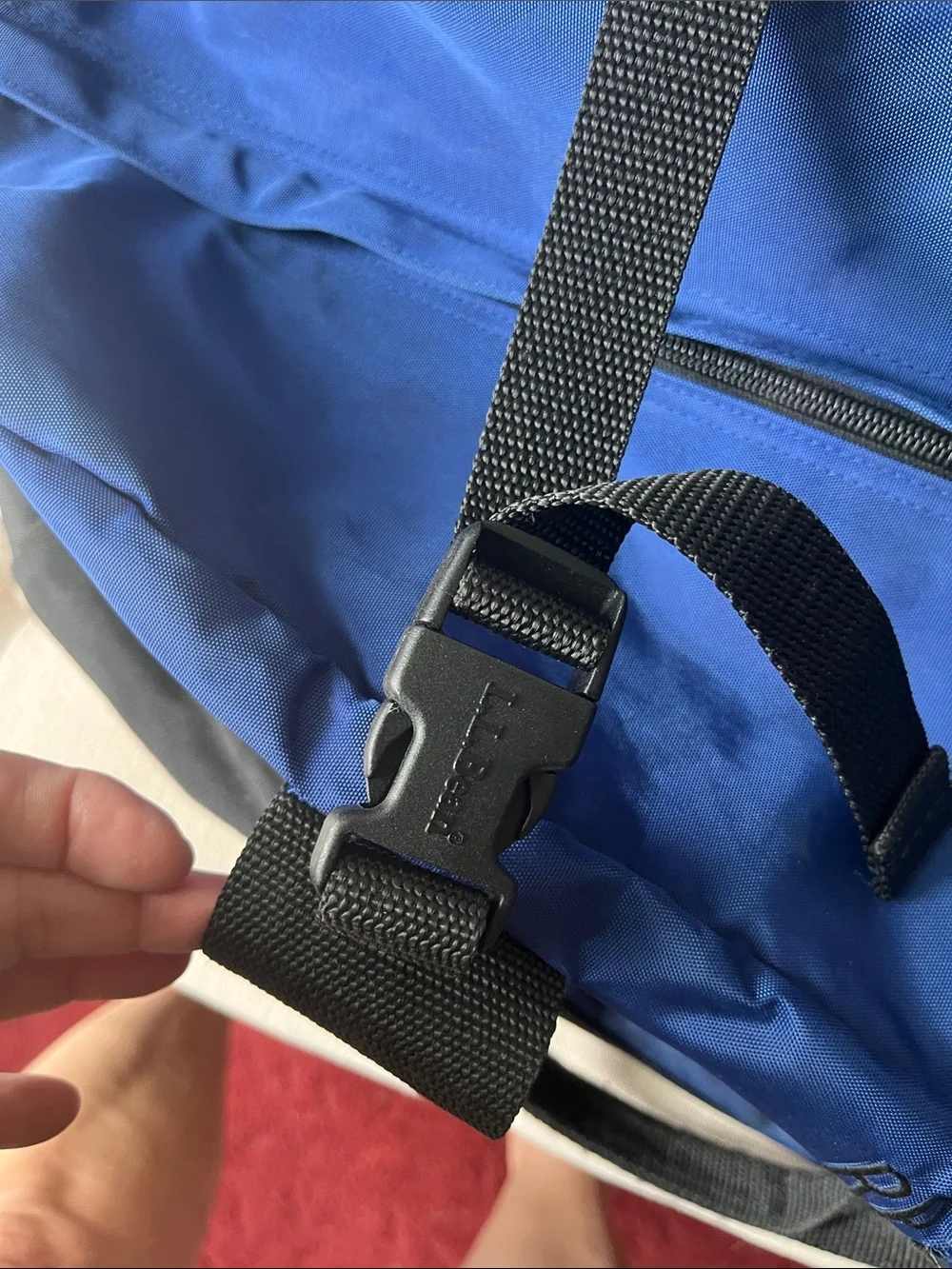 Blue and Black Duffel Bag one clip is broken. 10” x 20” x12”approximately